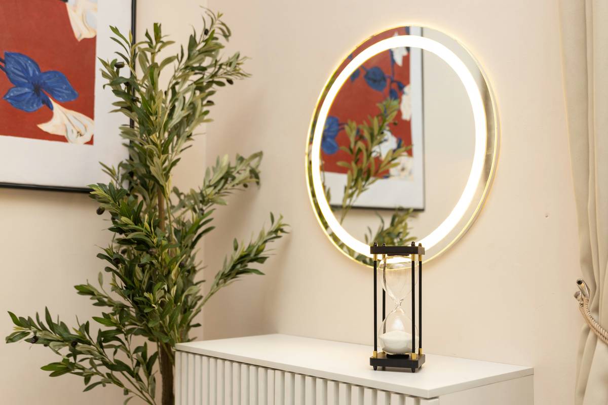 Modern bedroom featuring a smart mirror framed in walnut wood as part of decorative mirror home decor