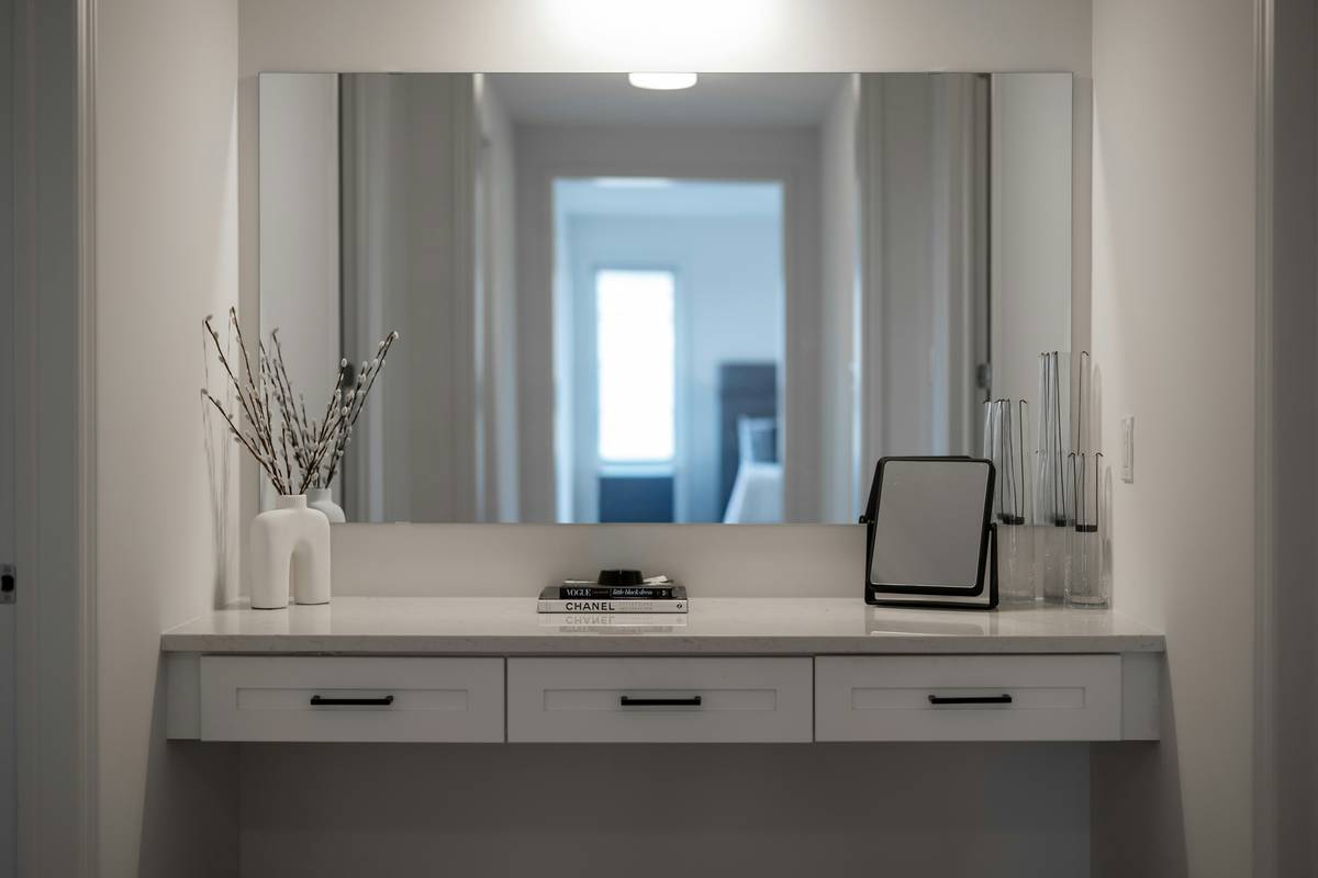 Modern bathroom featuring a sleek smart mirror as mirror home decor art with ambient LED lighting and minimalist fixtures